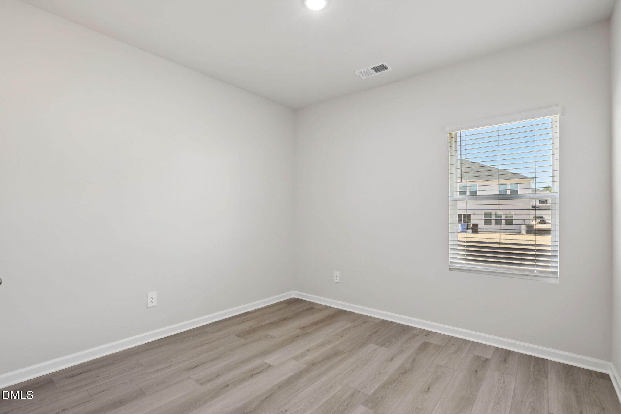 36 Hoff Court Angier, NC 27501 - Photo 17 of 43 wooden floor in an empty room with a window