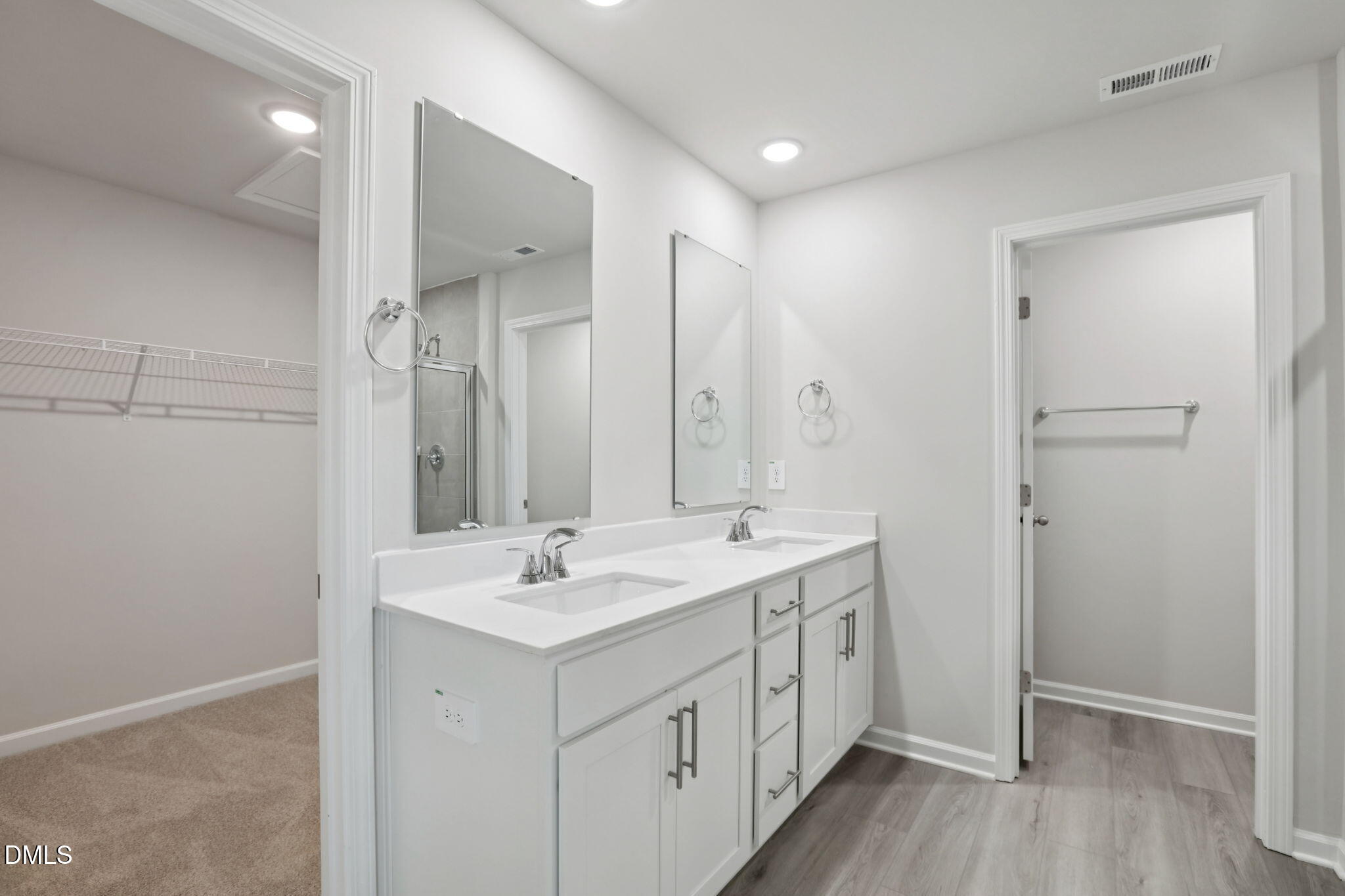 36 Hoff Court Angier, NC 27501 - Photo 24 of 43 a spacious bathroom with a double vanity sink a mirror and a shower