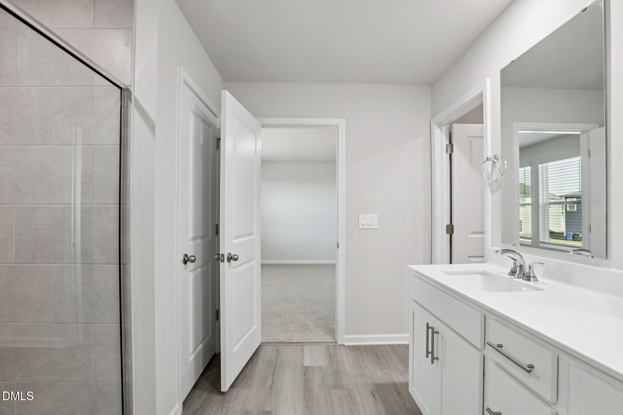 36 Hoff Court Angier, NC 27501 - Photo 25 of 43 a bathroom with a shower sink and mirror
