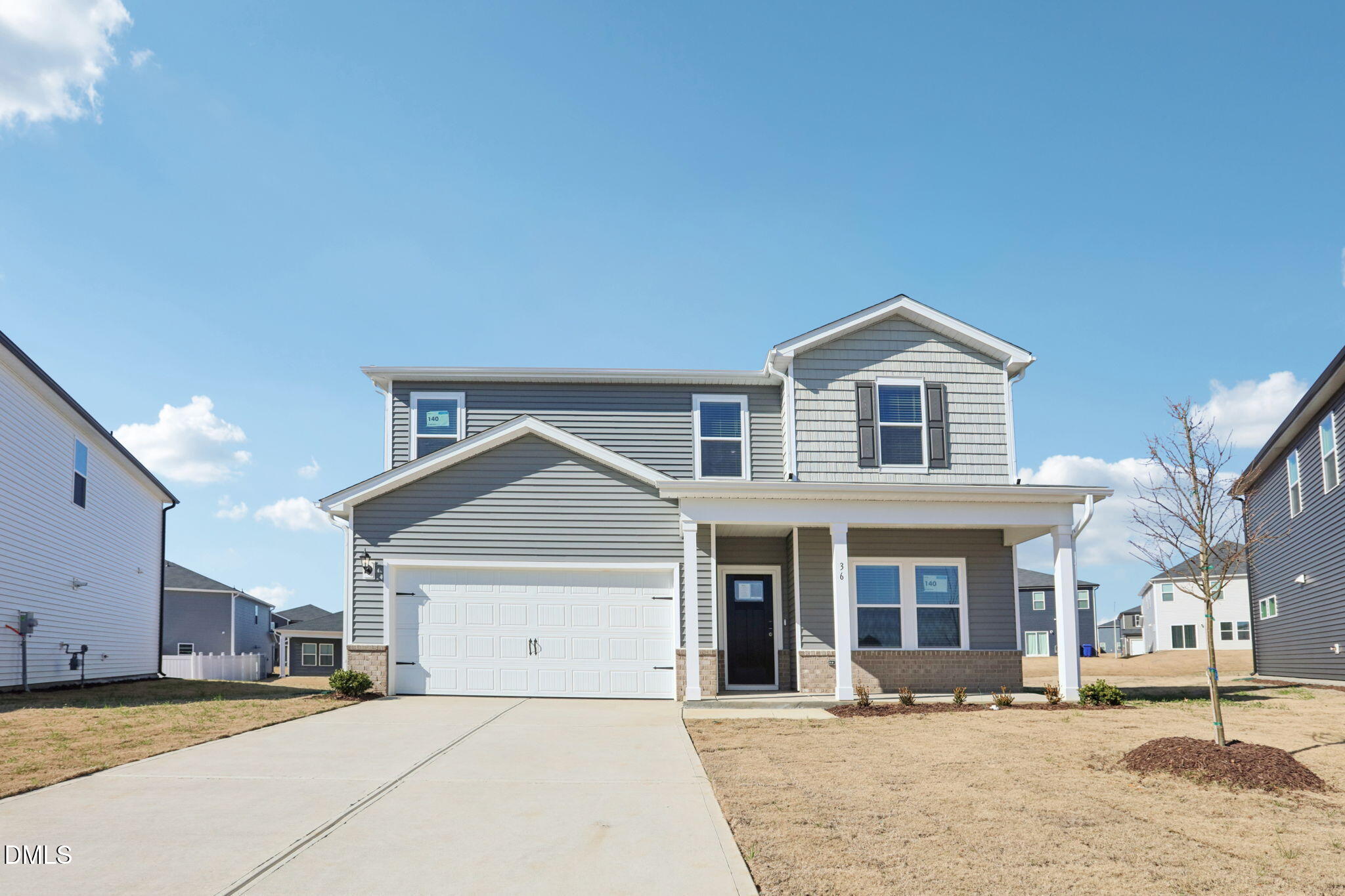 36 Hoff Court Angier, NC 27501 - Photo 2 of 43 a view of a white house with a large tree