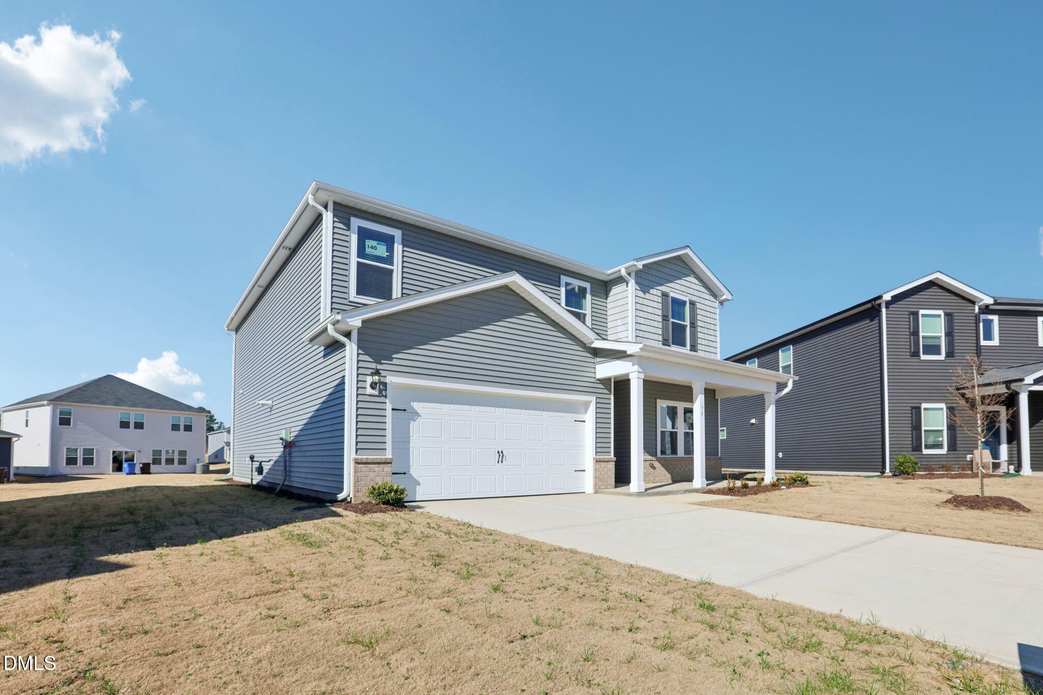 36 Hoff Court Angier, NC 27501 - Photo 4 of 43 a front view of a house with a yard and garage