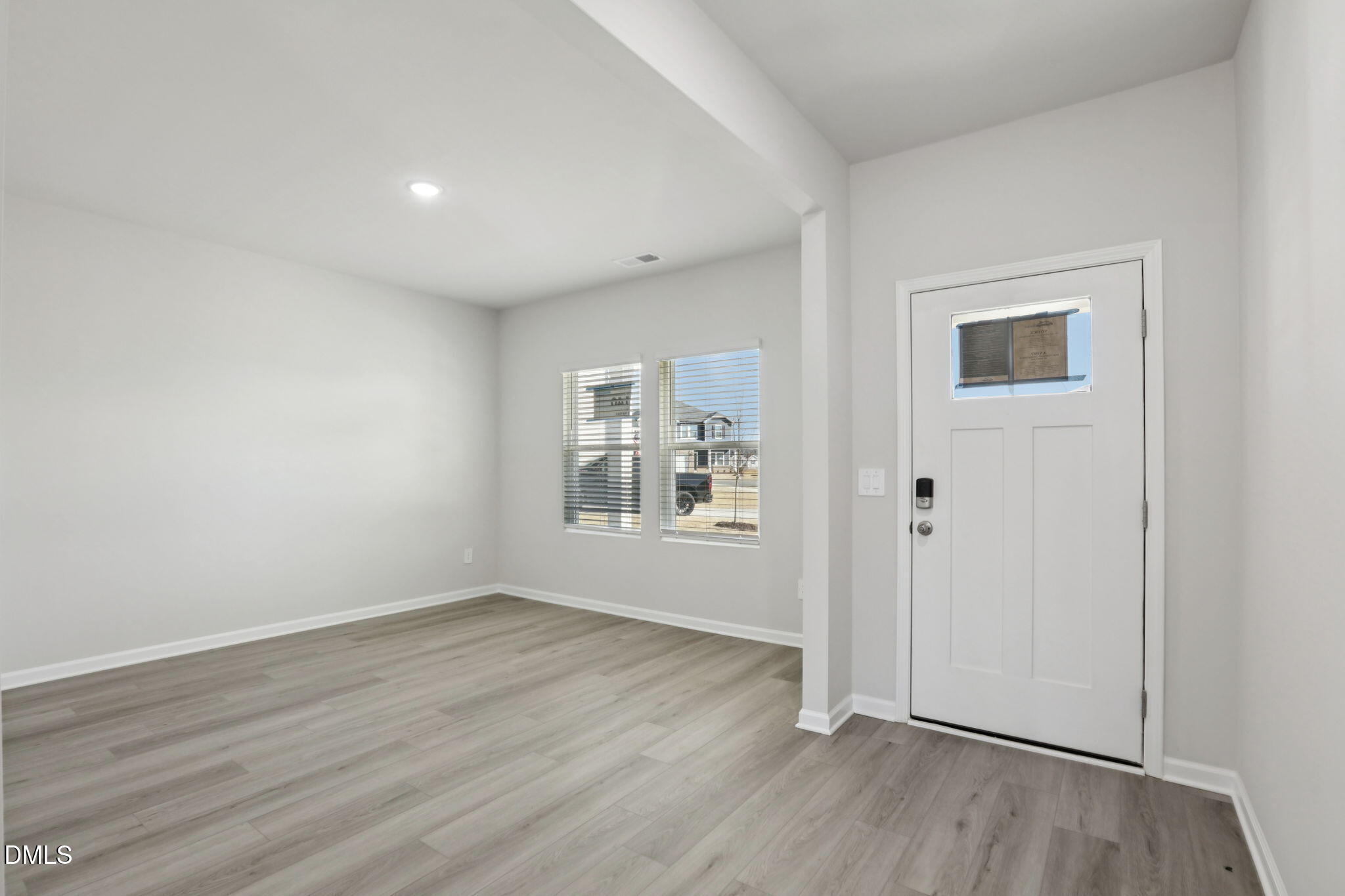 36 Hoff Court Angier, NC 27501 - Photo 8 of 43 an empty room with wooden floor and windows