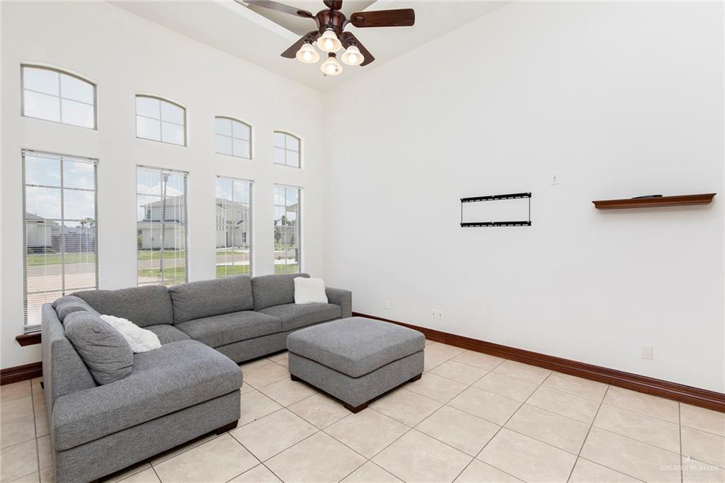 1213 Rhett Drive Pharr, TX 78577 - Photo 5 of 19 Spacious living room with vaulted ceilings, oversized windows, and abundant natural light.