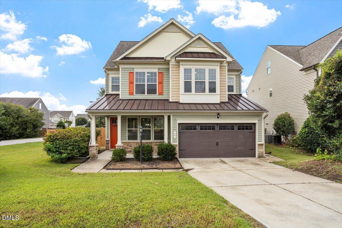 15 Crest Circle Garner, NC 27529 - Photo 1 of 41 a front view of a house with garden