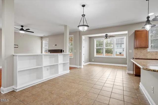 a view of a kitchen with a sink and a window