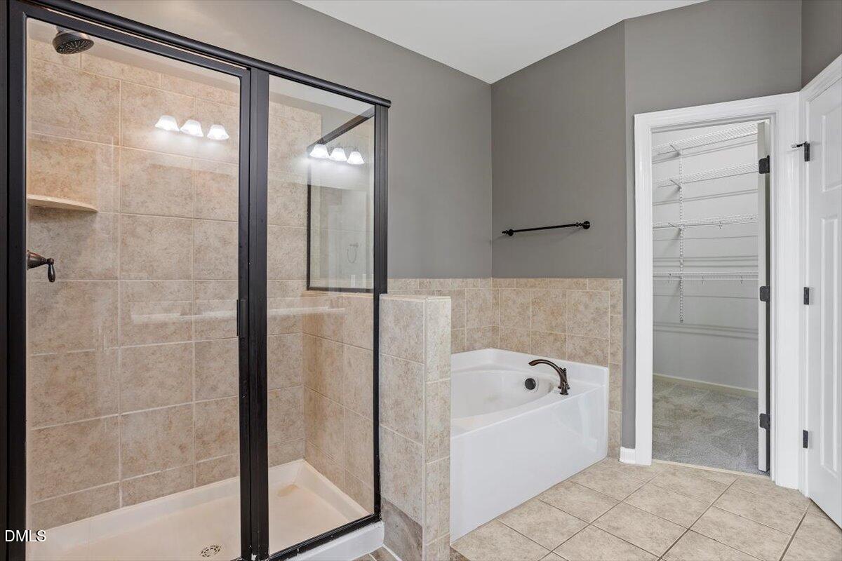 15 Crest Circle Garner, NC 27529 - Photo 19 of 41 a bathroom with a bathtub and shower
