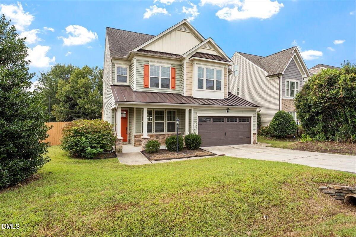 15 Crest Circle Garner, NC 27529 - Photo 2 of 41 a front view of a house with a yard and garage