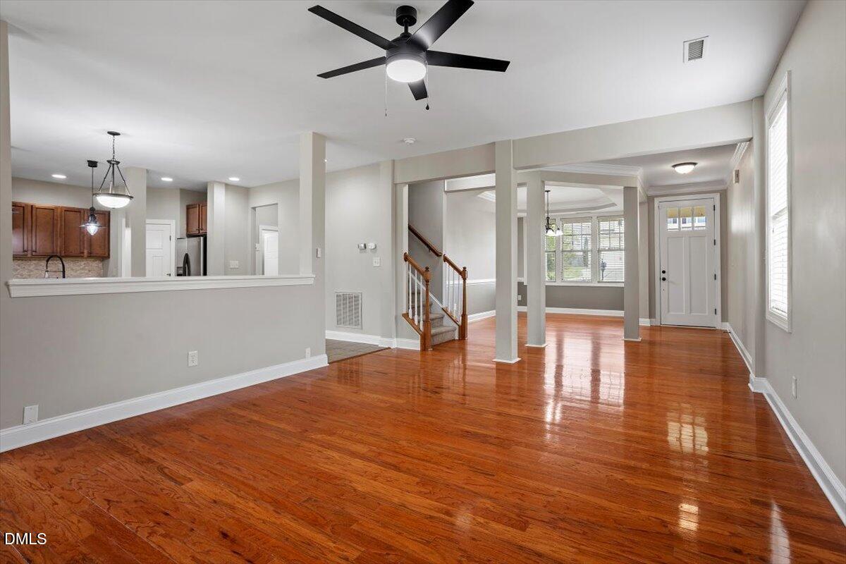 15 Crest Circle Garner, NC 27529 - Photo 4 of 41 a view of empty room with wooden floor and fan