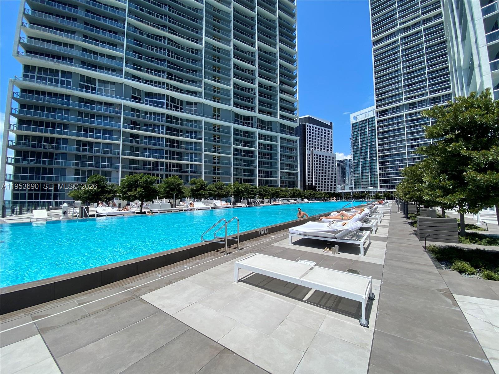465 Brickell Avenue, Unit 3004 Miami, FL 33131 - Photo 13 of 17 a view of a backyard with plants and tree s