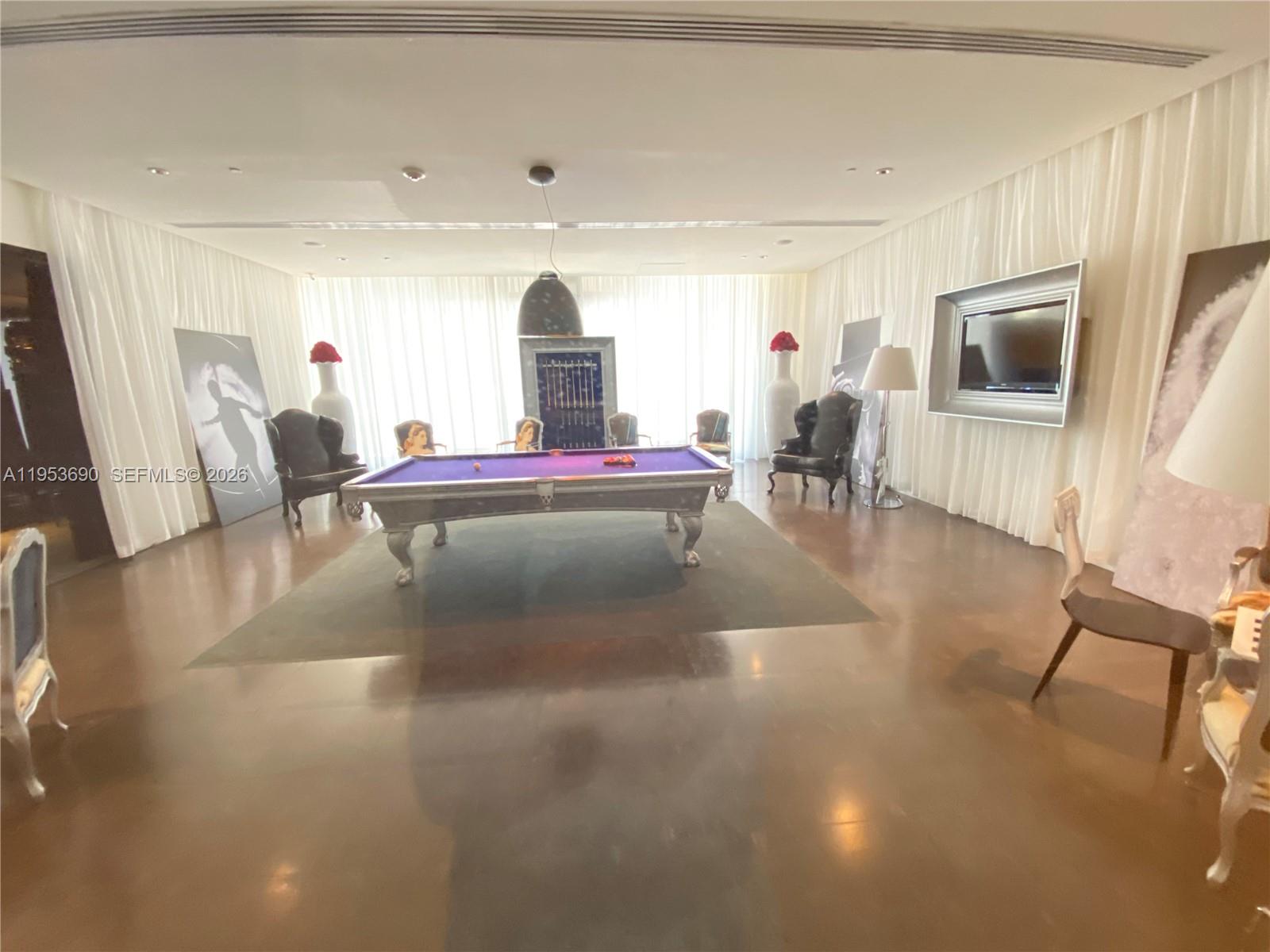 465 Brickell Avenue, Unit 3004 Miami, FL 33131 - Photo 17 of 17 a living room with furniture and a flat screen tv