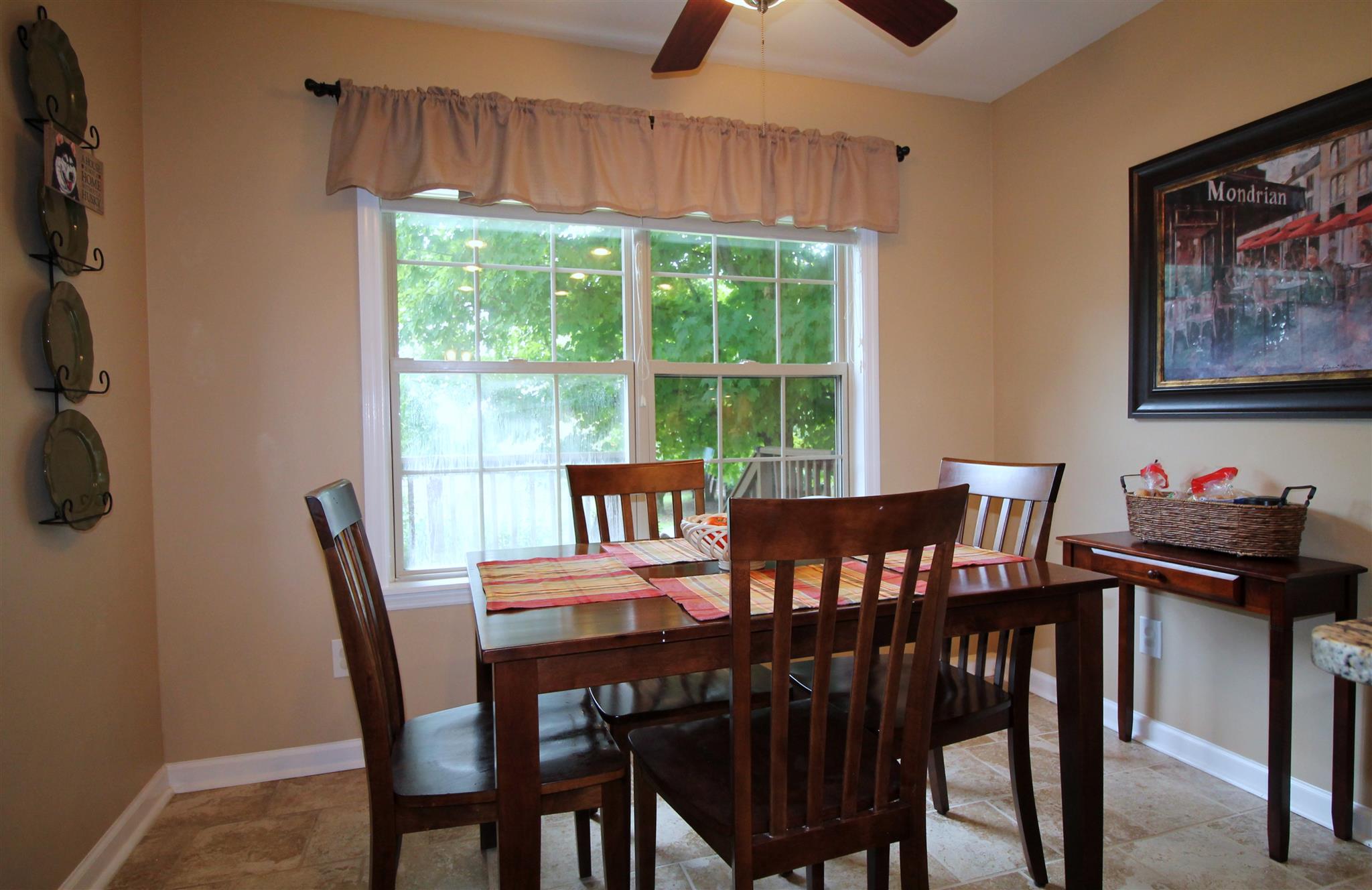 1539 West Harpeth Road Franklin, TN 37064 - Photo 11 of 30 a view of a dining room with furniture window and outside view