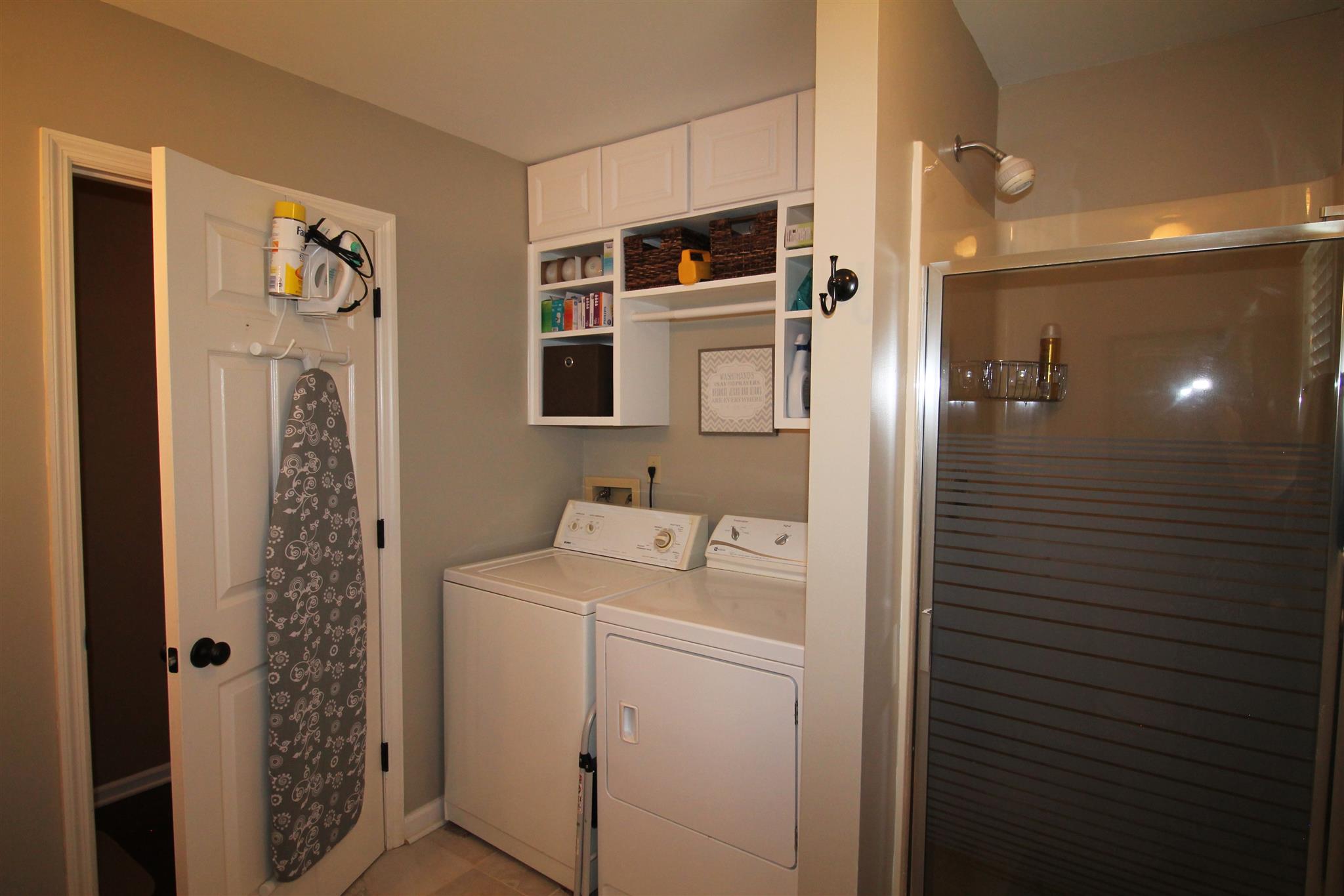 1539 West Harpeth Road Franklin, TN 37064 - Photo 12 of 30 a bathroom with a sink a toilet and shower