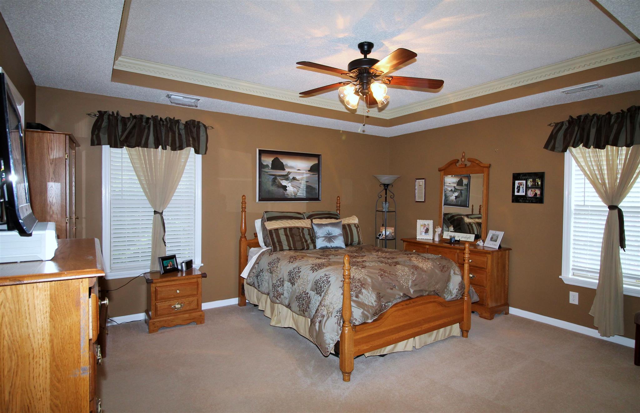 1539 West Harpeth Road Franklin, TN 37064 - Photo 13 of 30 a bedroom with a bed and a chandelier