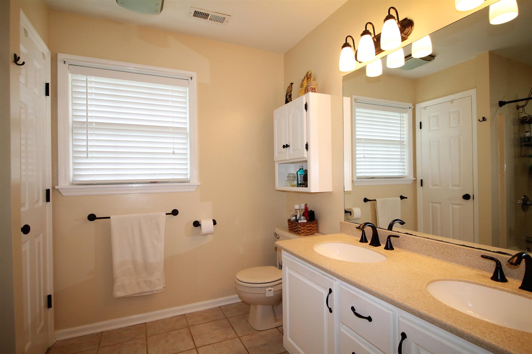 1539 West Harpeth Road Franklin, TN 37064 - Photo 15 of 30 a bathroom with a double vanity sink mirror and toilet