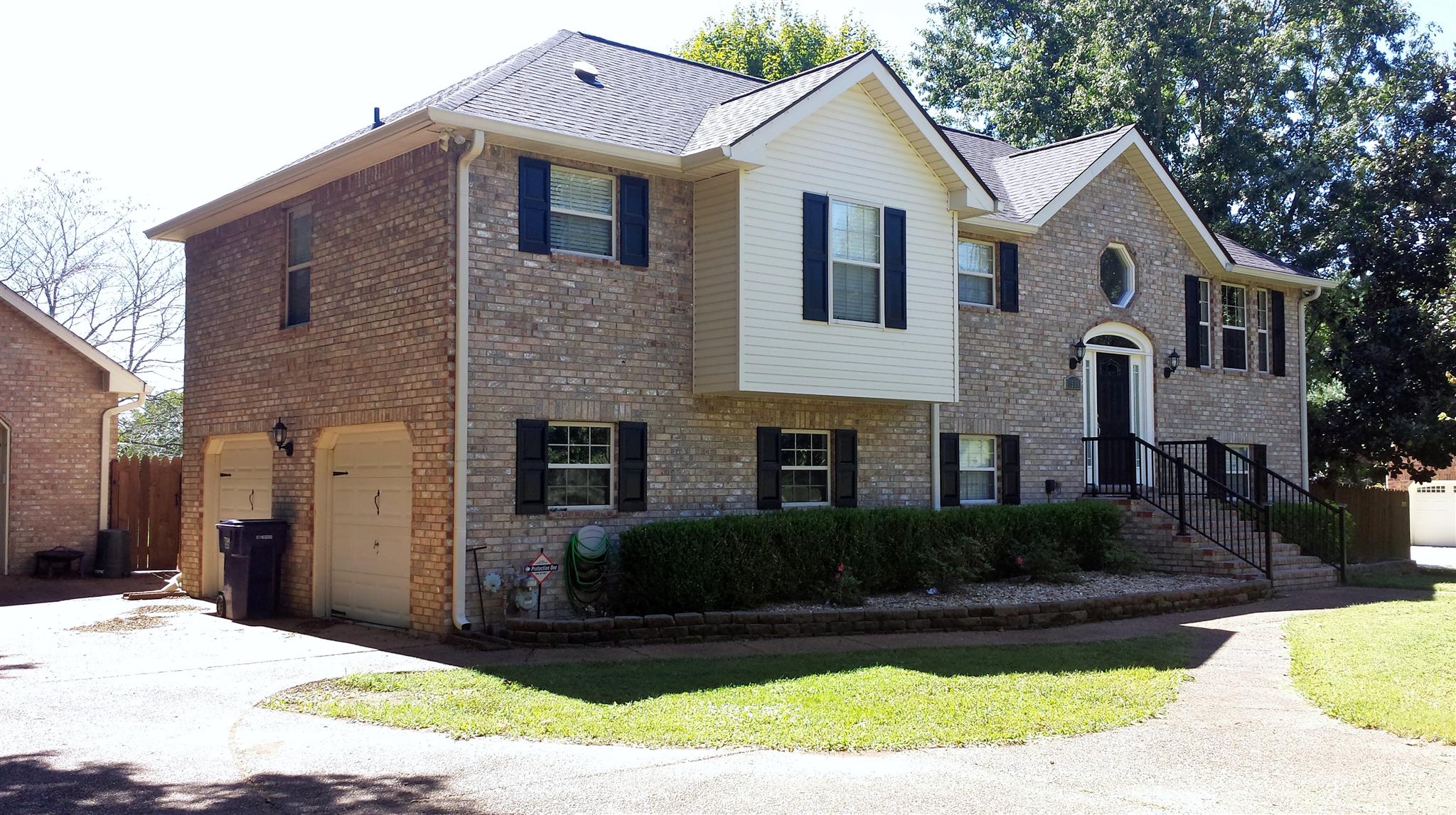 1539 West Harpeth Road Franklin, TN 37064 - Photo 2 of 30 a front view of a house with a yard