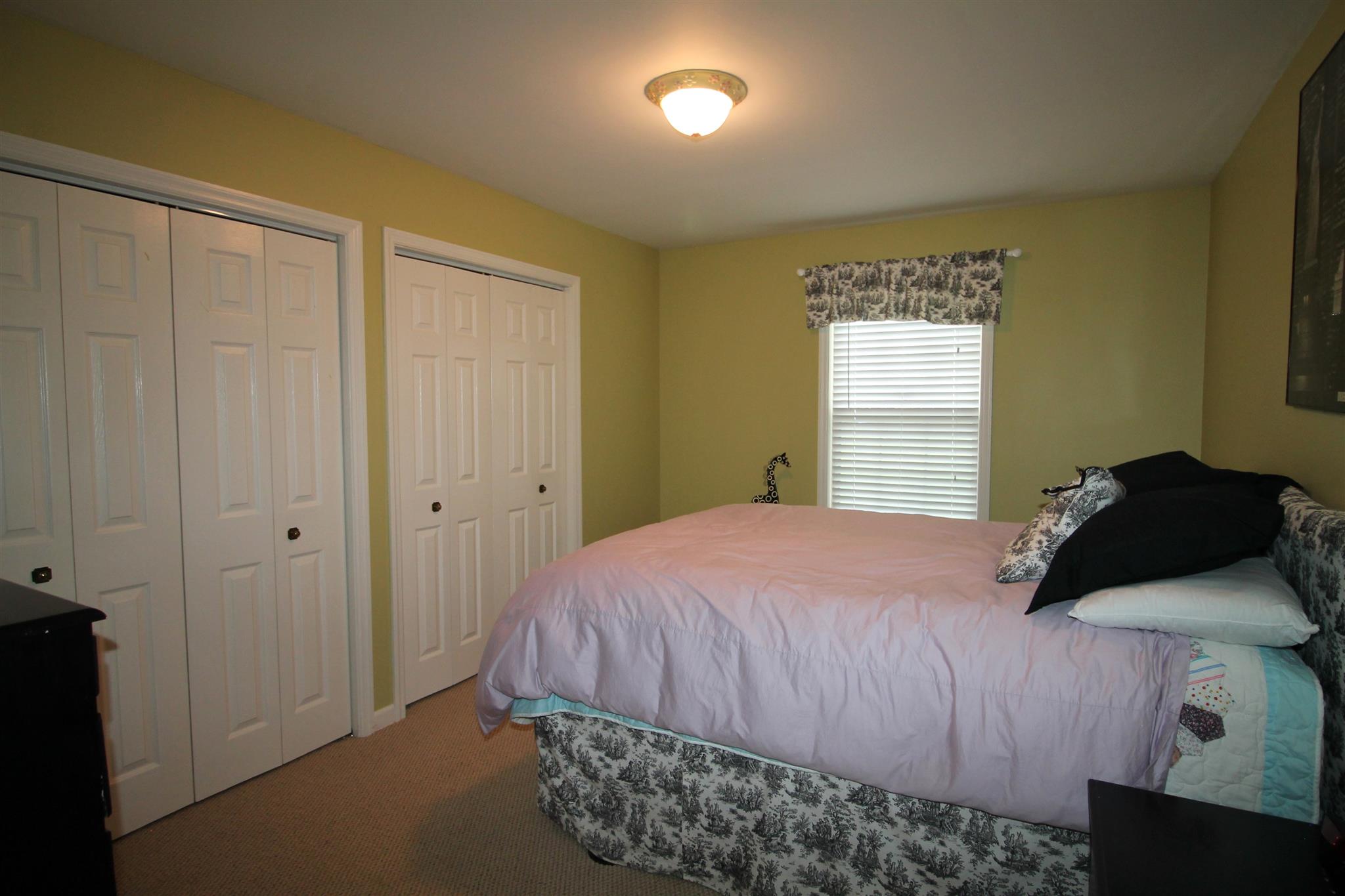 1539 West Harpeth Road Franklin, TN 37064 - Photo 21 of 30 a bedroom with a bed and a window