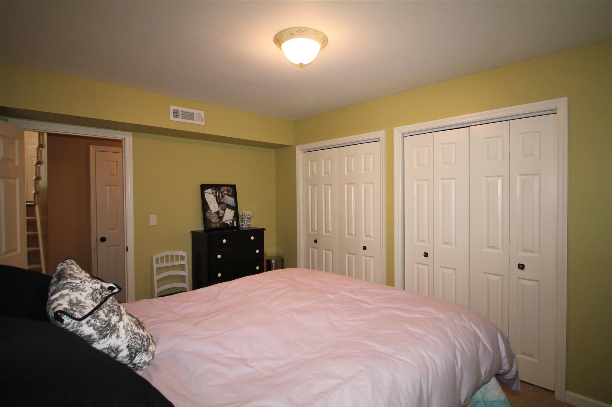 1539 West Harpeth Road Franklin, TN 37064 - Photo 22 of 30 a bedroom with a bed and a closet