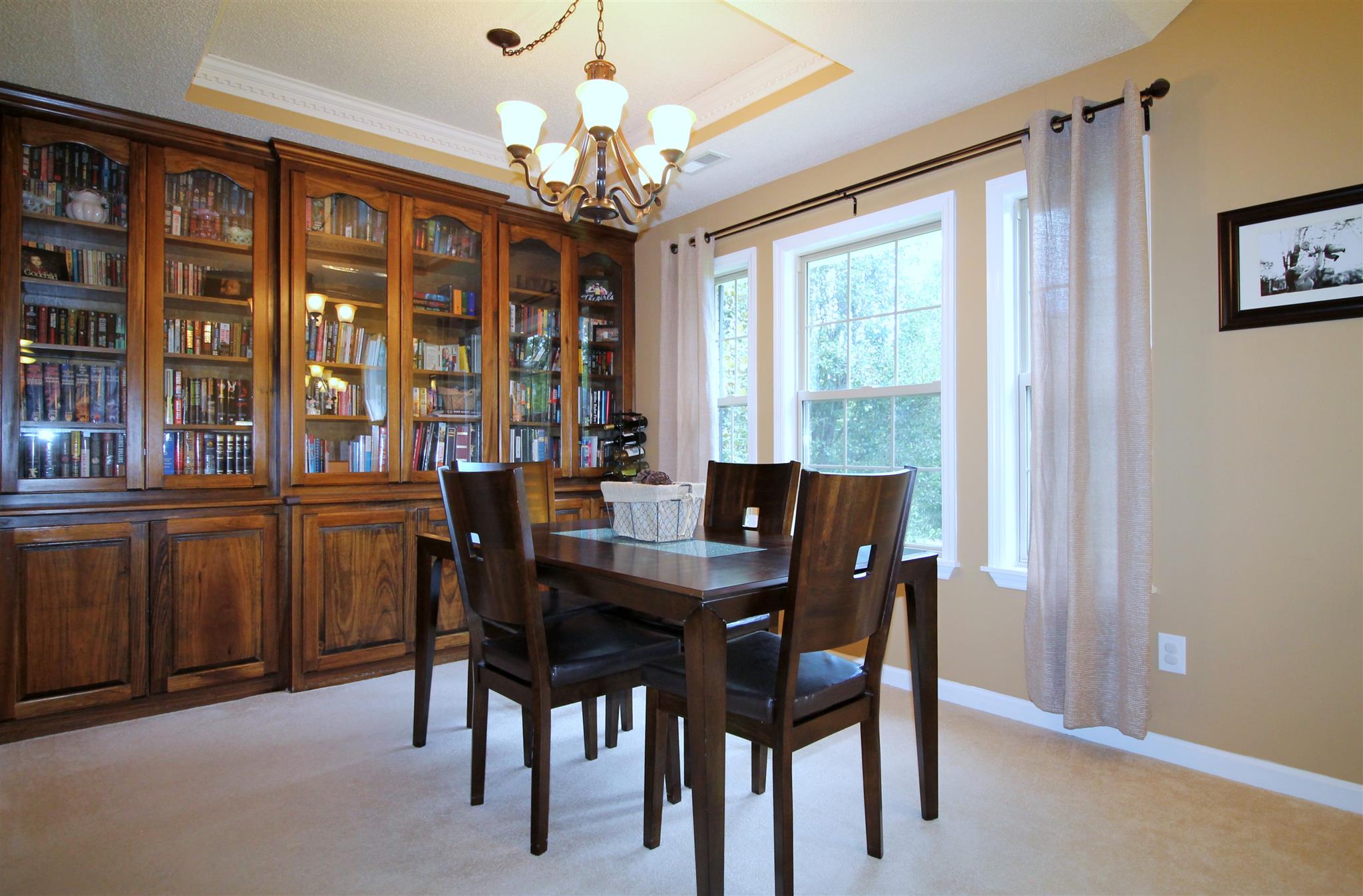 1539 West Harpeth Road Franklin, TN 37064 - Photo 4 of 30 a view of a dining room with furniture and chandelier