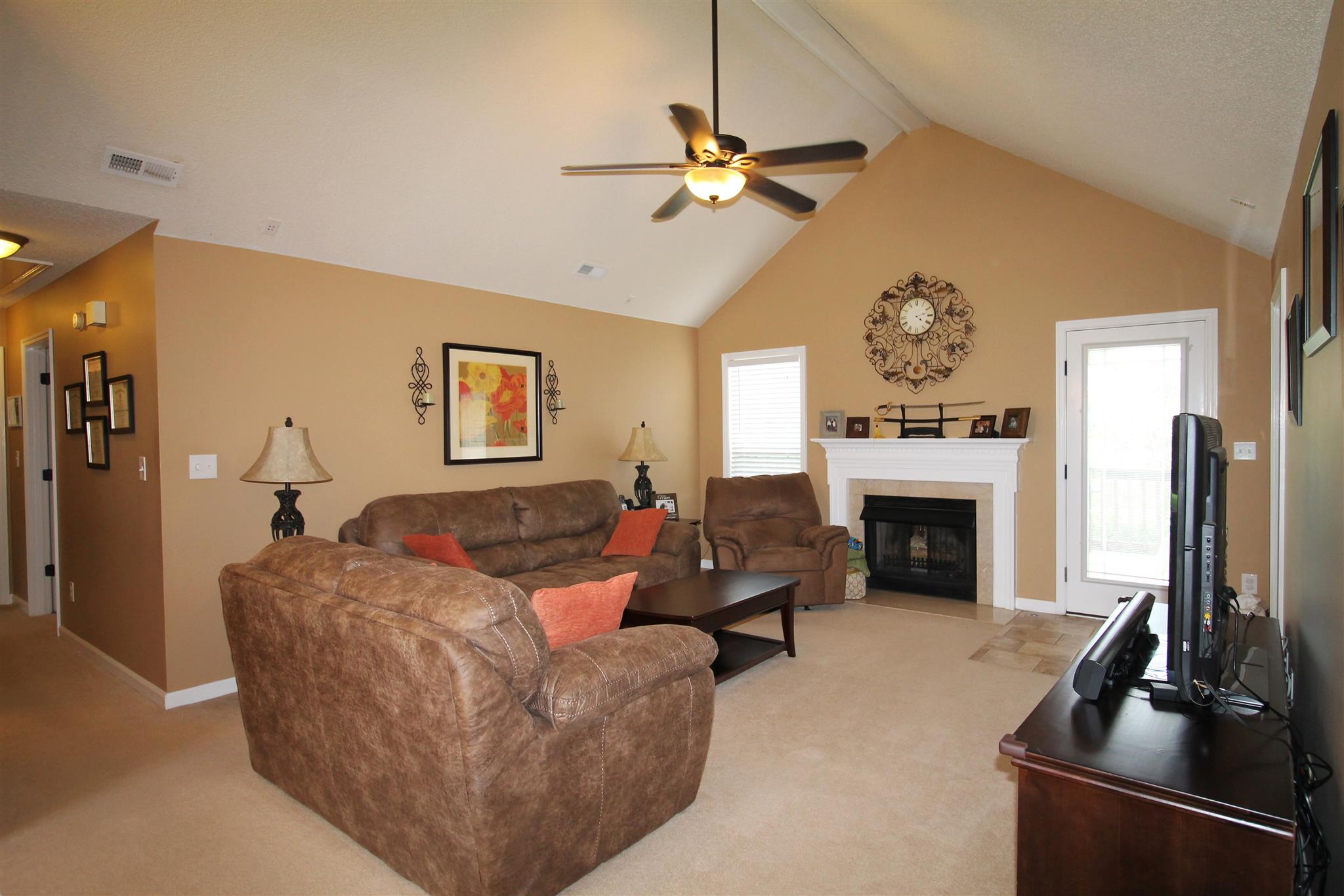 1539 West Harpeth Road Franklin, TN 37064 - Photo 6 of 30 a living room with furniture a fireplace and a flat screen tv