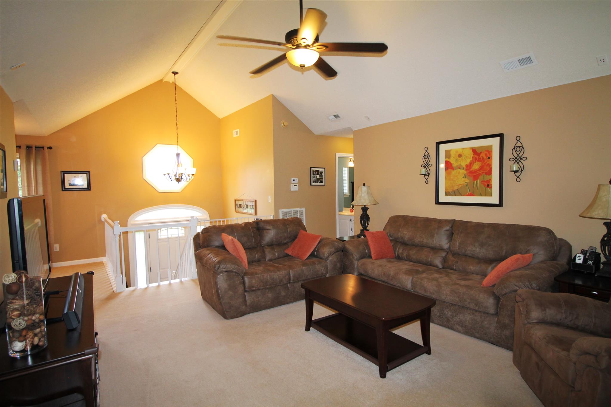 1539 West Harpeth Road Franklin, TN 37064 - Photo 7 of 30 a living room with furniture a ceiling fan and a flat screen tv