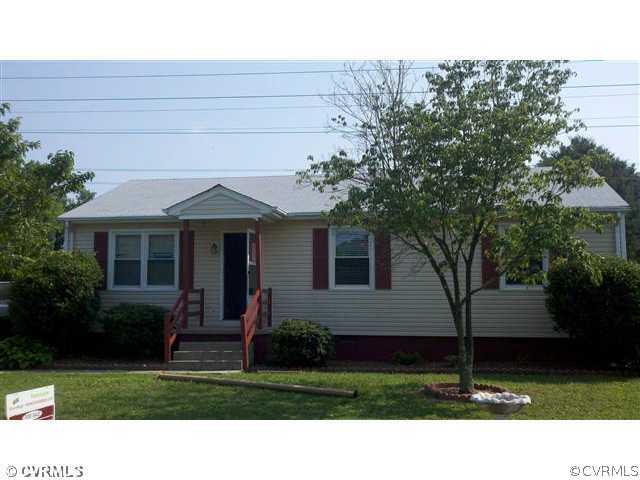 a view of house with yard