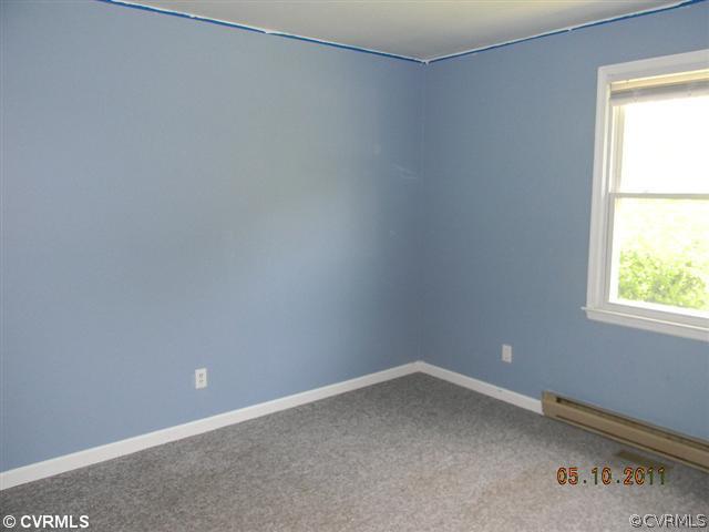 17850 Willowynde Road Chester, VA 23836 - Photo 4 of 5 an empty room with a window
