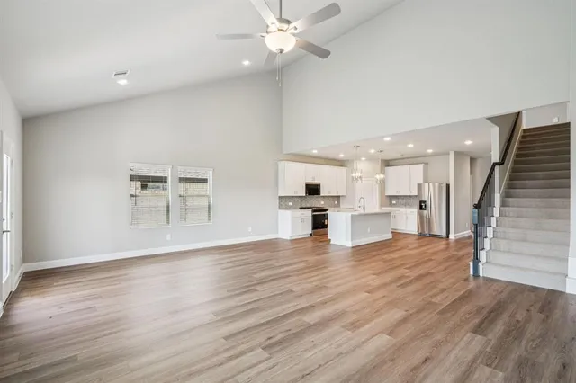 a view of kitchen with furniture and wooden floor