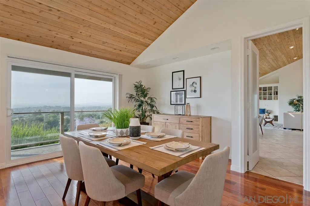 13606 Acorn Patch Lane Poway, CA 92064 - Photo 14 of 25 a view of a dining room with furniture window and wooden floor
