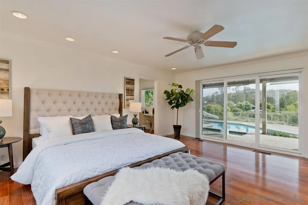 13606 Acorn Patch Lane Poway, CA 92064 - Photo 20 of 25 a bedroom with furniture and a large window