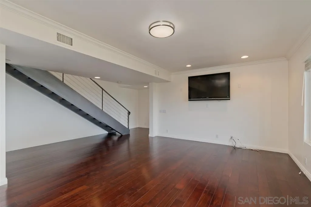 13606 Acorn Patch Lane Poway, CA 92064 - Photo 23 of 25 a view of an empty room with wooden floor and a window