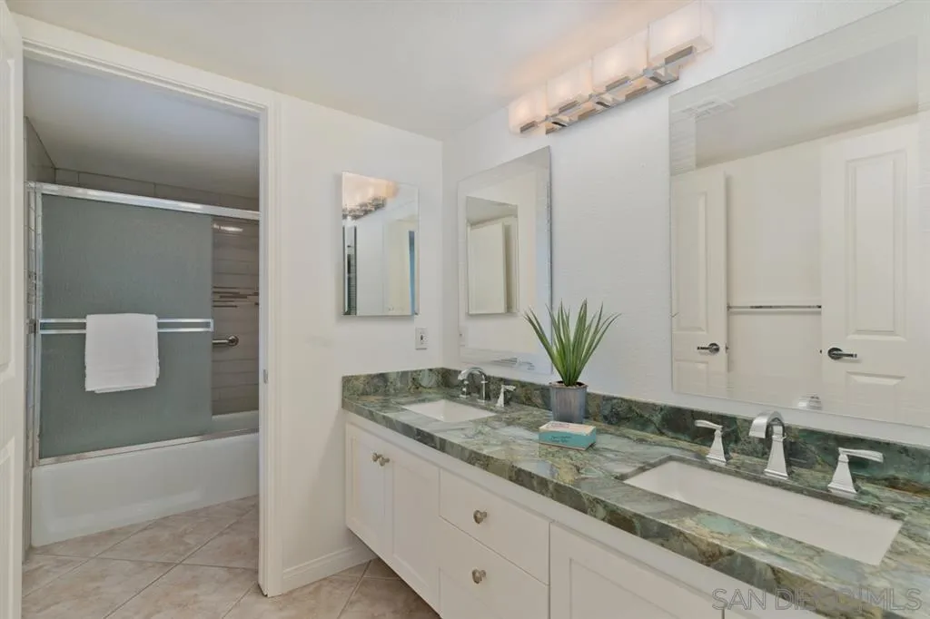 13606 Acorn Patch Lane Poway, CA 92064 - Photo 25 of 25 a bathroom with a granite countertop sink and a mirror