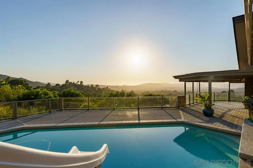 13606 Acorn Patch Lane Poway, CA 92064 - Photo 6 of 25 a view of a swimming pool with a patio