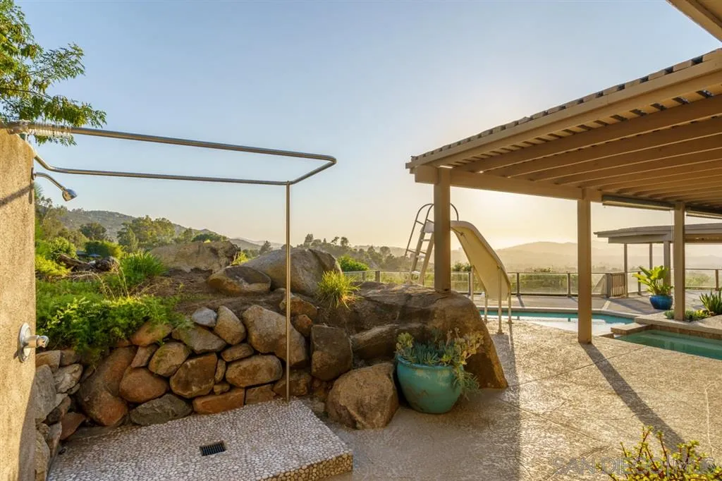 13606 Acorn Patch Lane Poway, CA 92064 - Photo 7 of 25 a view of a porch with furniture and floor to ceiling window