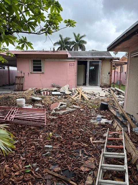 7161 Southwest 22nd Street Miami, FL 33155 - Photo 9 of 11 a front view of a house with a garden