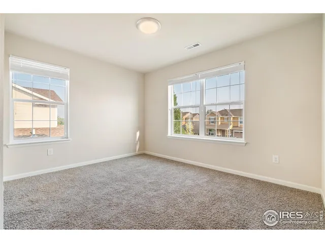 a bathroom with a sink a toilet a mirror and shower