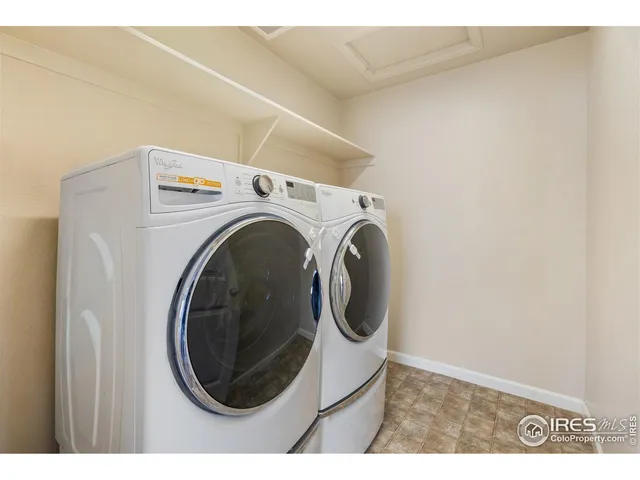 a living room with furniture rug and window