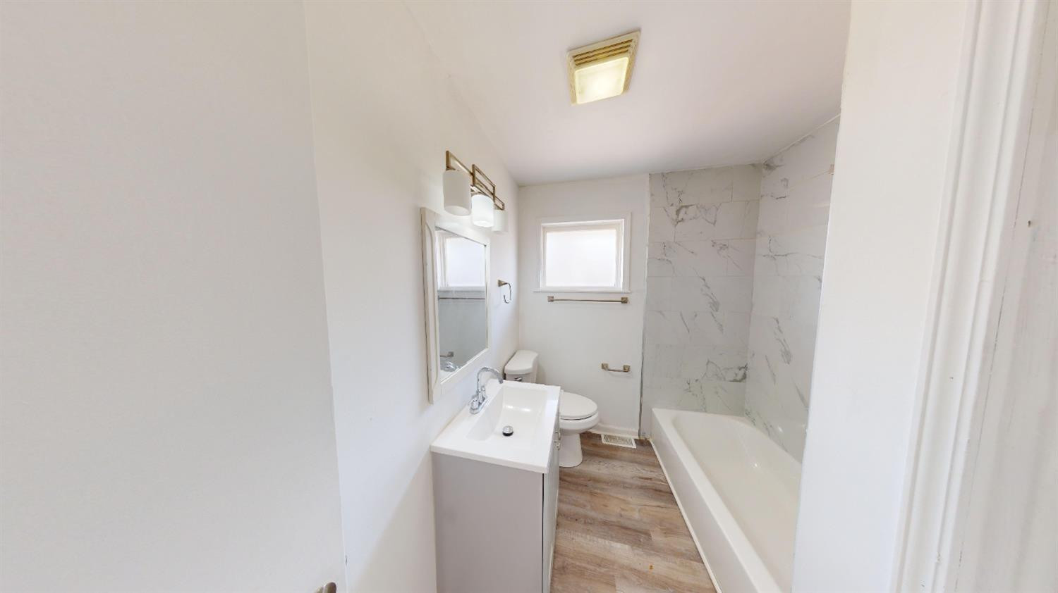 608 East Ridge Road Gary, IN 46409 - Photo 10 of 27 a bathroom with a bathtub and a shower