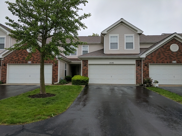 2116 Peach Tree Lane, Unit 4243 Algonquin, IL 60102 - Photo 1 of 25 front view of a house with a yard