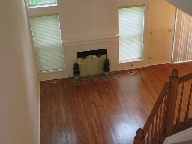 2116 Peach Tree Lane, Unit 4243 Algonquin, IL 60102 - Photo 16 of 25 a view of a room with wooden floor and a window