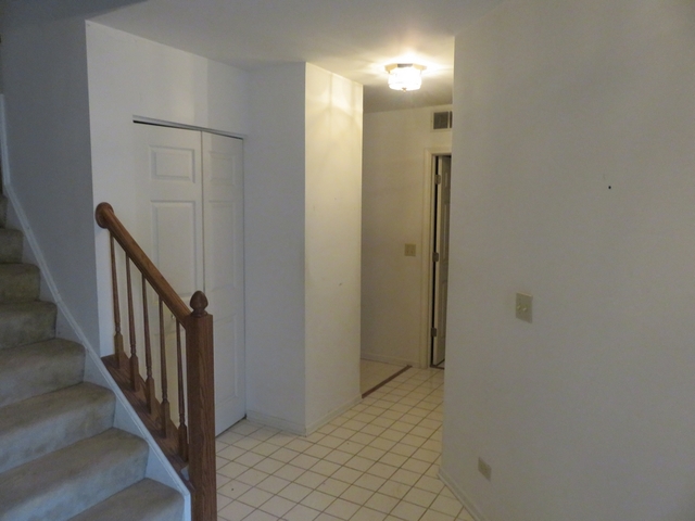 2116 Peach Tree Lane, Unit 4243 Algonquin, IL 60102 - Photo 3 of 25 a view of a hallway with wooden floor
