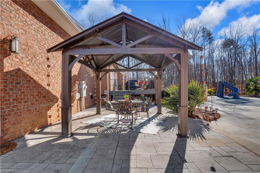 7897 Misty Hollow Lane Oak Ridge, NC 27310 - Photo 21 of 50 Perfect spot for lunch by the pool