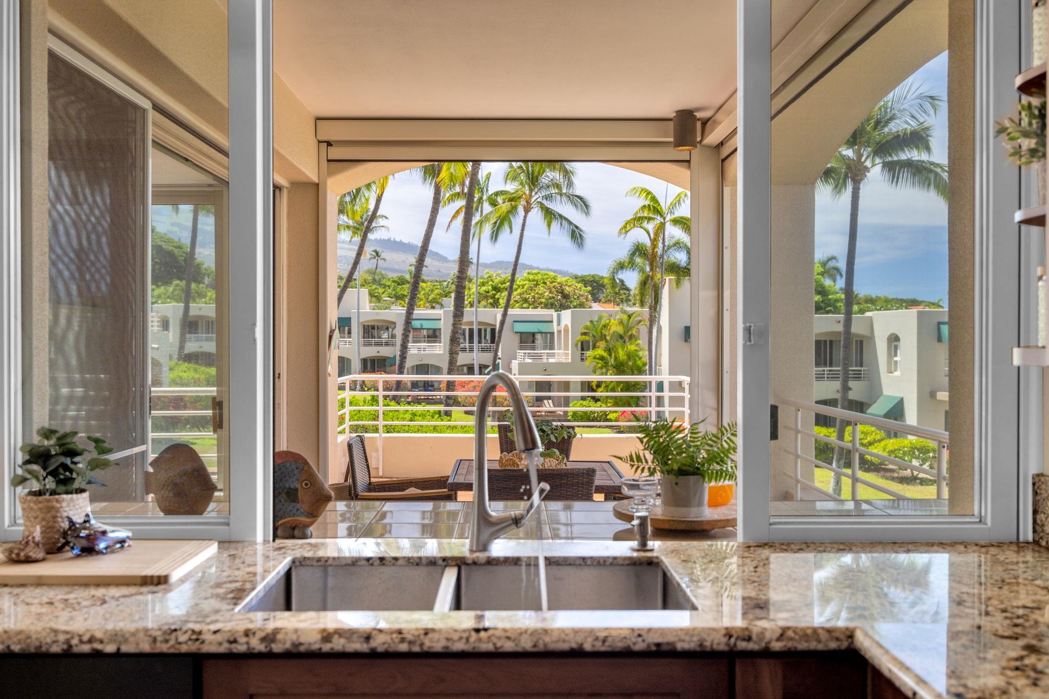 3150 Wailea Alanui Drive, Unit 2504 Kihei, HI 96753 - Photo 18 of 47 a kitchen with granite countertop a sink and a window