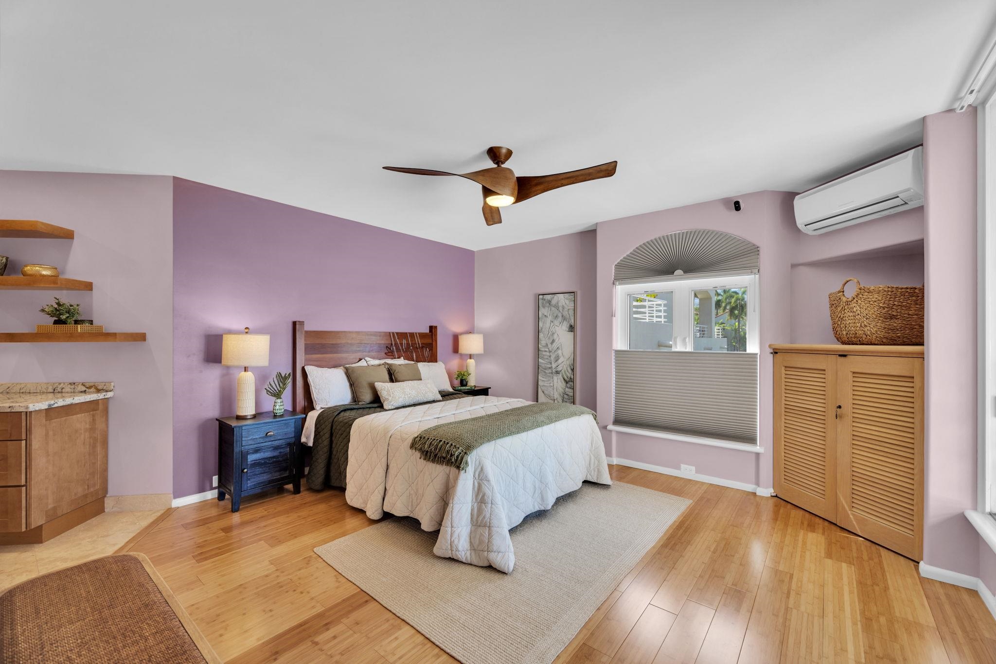 3150 Wailea Alanui Drive, Unit 2504 Kihei, HI 96753 - Photo 23 of 47 a bedroom with a bed and a chandelier