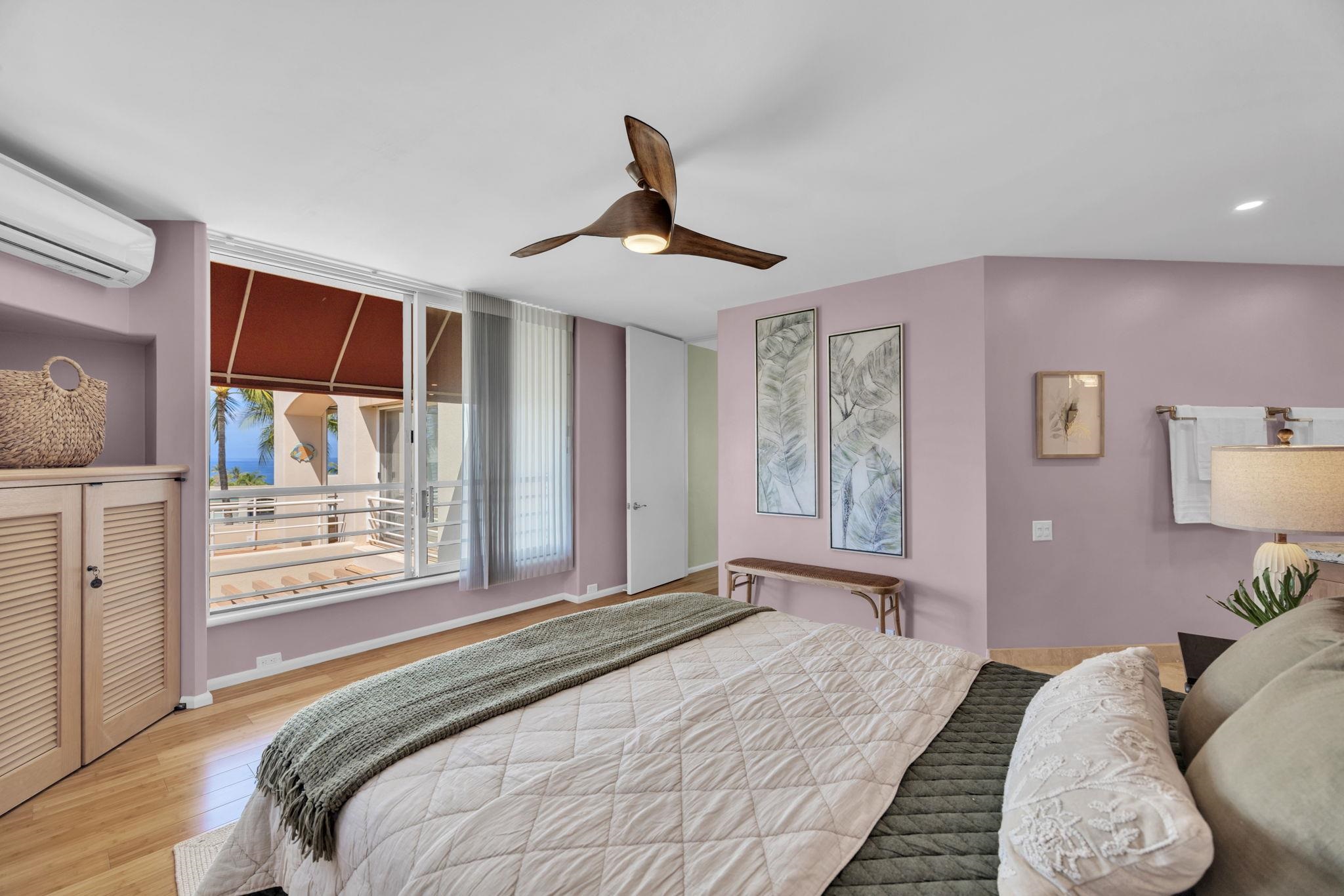 3150 Wailea Alanui Drive, Unit 2504 Kihei, HI 96753 - Photo 25 of 47 a bedroom with a large bed and a chandelier