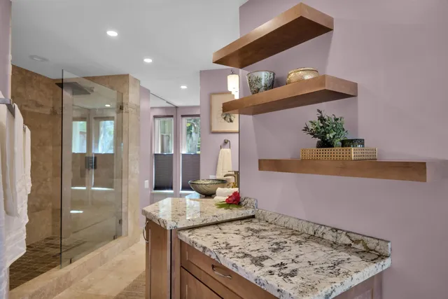 a living room with kitchen island granite countertop furniture and a rug