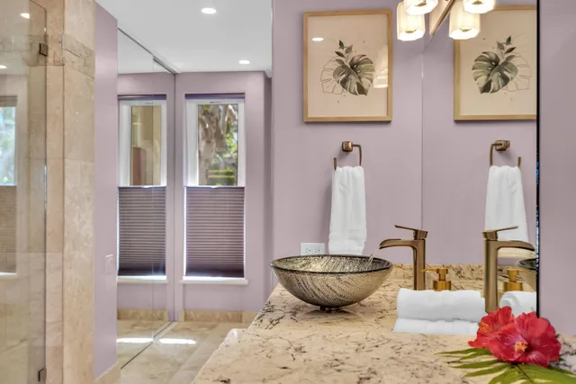 a view of a bathroom with a tub and shower