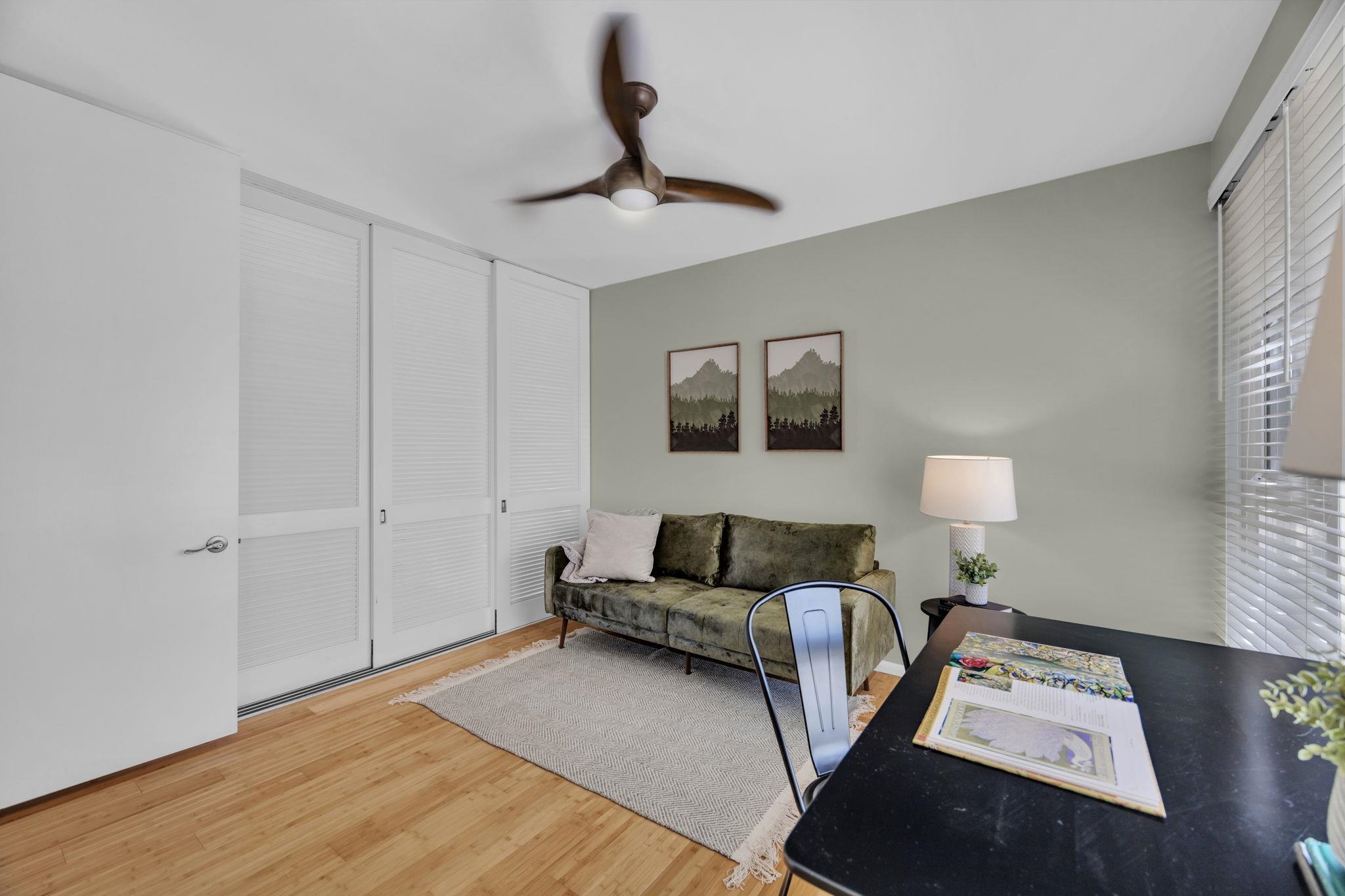 3150 Wailea Alanui Drive, Unit 2504 Kihei, HI 96753 - Photo 35 of 47 a living room with furniture and a wooden floor