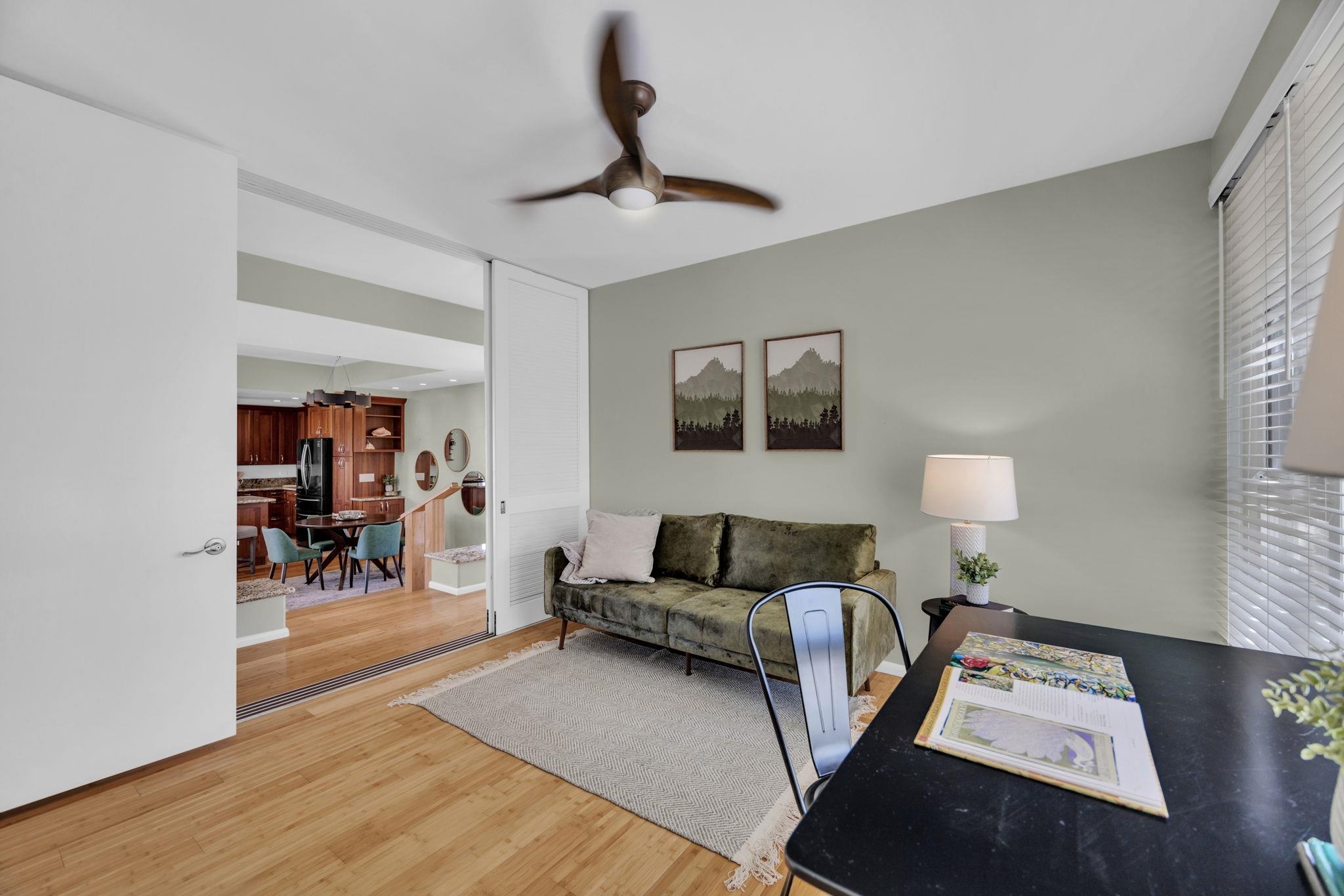 3150 Wailea Alanui Drive, Unit 2504 Kihei, HI 96753 - Photo 36 of 47 a living room with furniture and a wooden floor