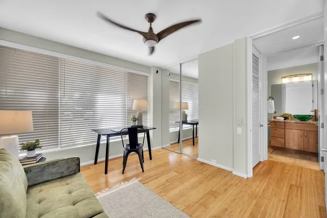 a view of a livingroom with furniture and a kitchen
