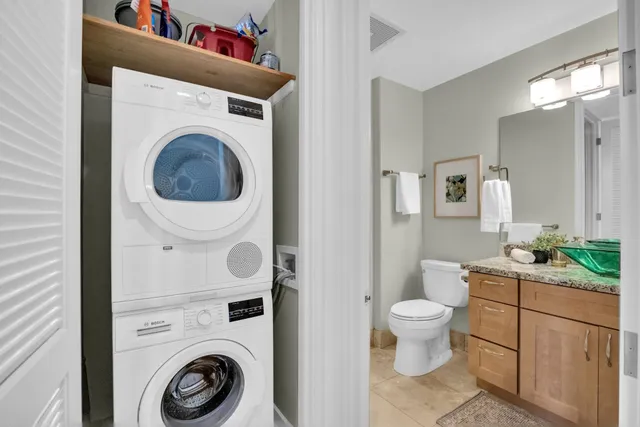 a view of bathroom with a washer and dryer